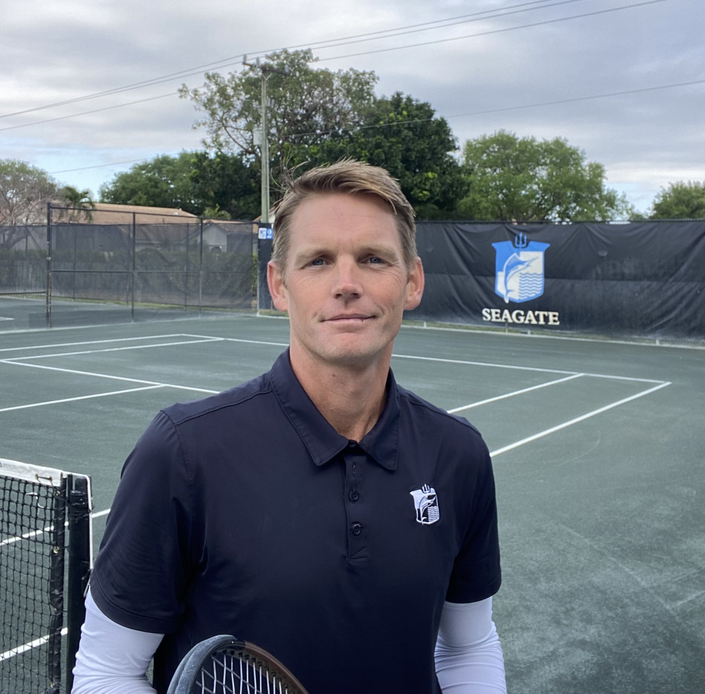 a man standing on a tennis court