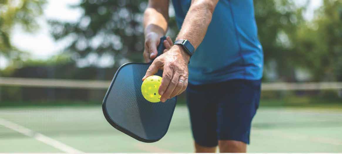 man playing in a pickleball clinic