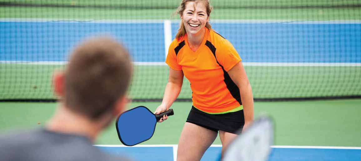 young girl playing pickle ball