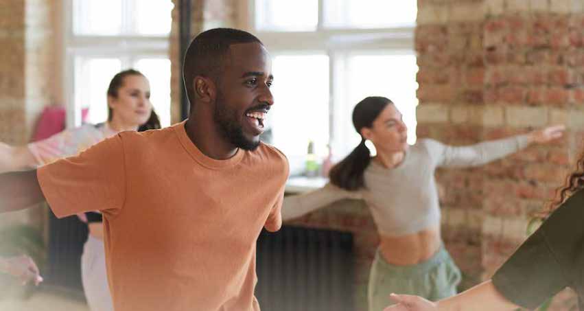 zumba class man smiling and dancing