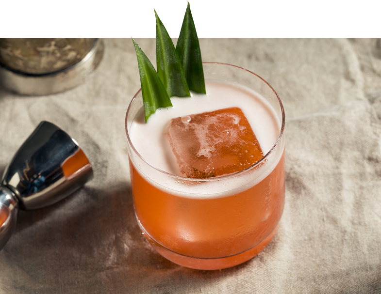 Close up of an orange cocktail with ice cubes
