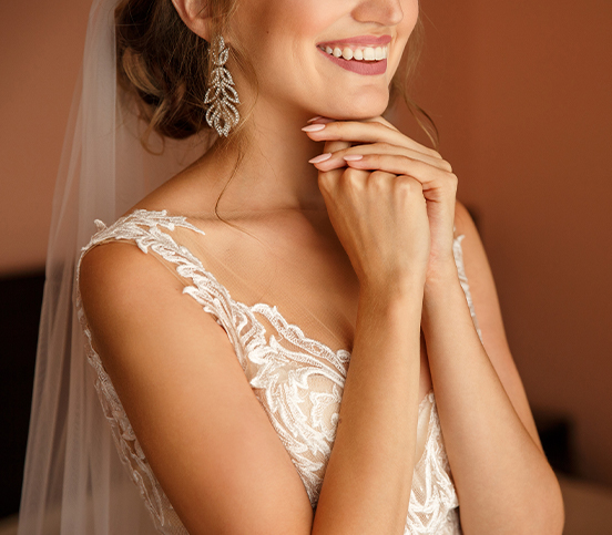 close up of a bride on her wedding dress smiling