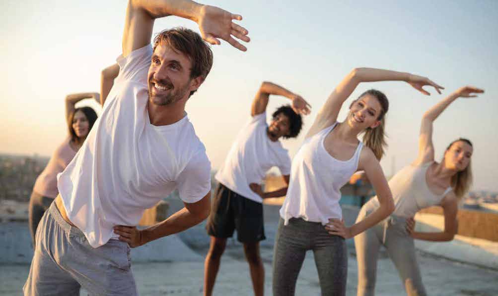 group fitness class stretching on the rooftop
