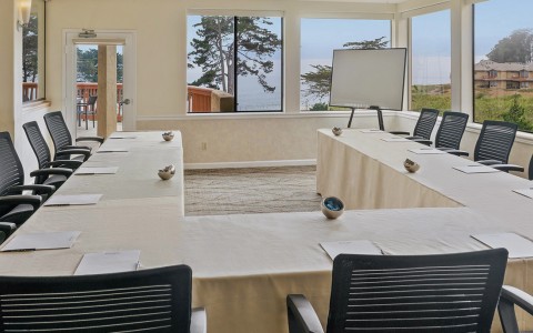 conference room u shape table and white cloth header