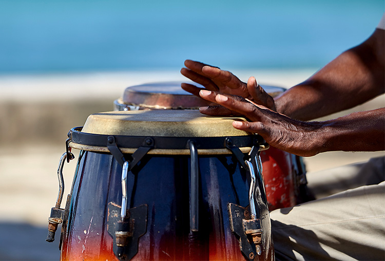Close up of hands playing drums