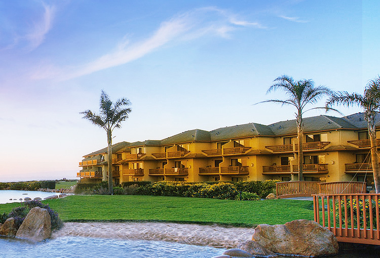 yellow property building overlooking the water