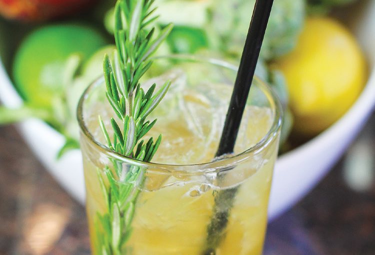 close up of drink with green herb