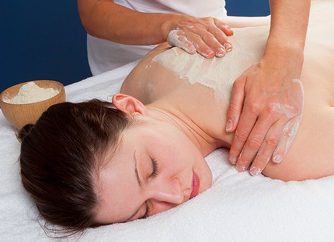 a woman getting a back massage