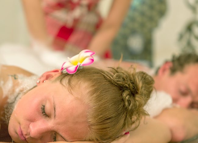 a woman laying down getting a massage