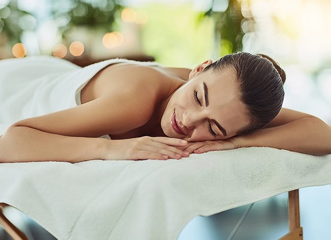 a woman laying down for a massage