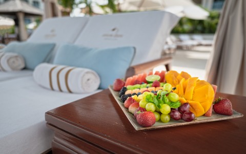 fruit platter next to lounge chairs