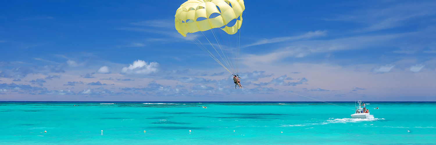 Boat pulling parasailer in the ocean
