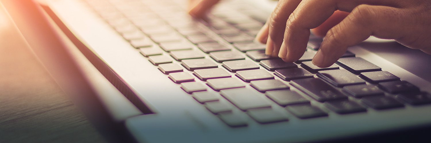 hands on a laptop keyboard