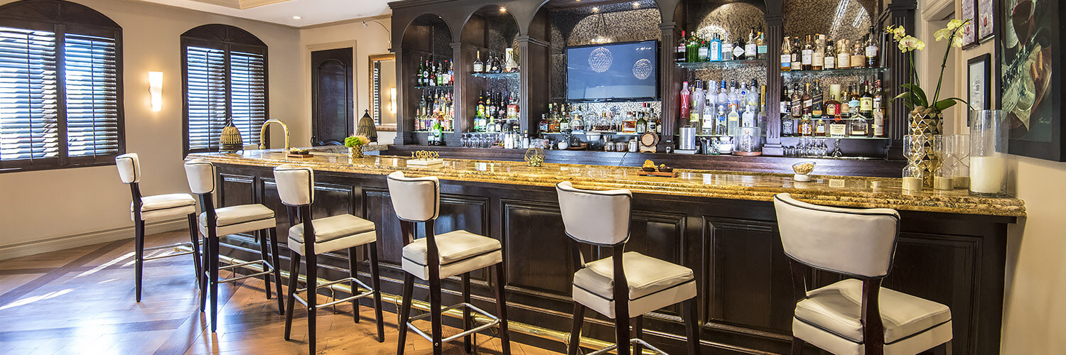 barstools lined up against bar inside
