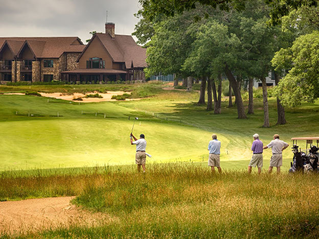 four guys playing golf at sewanee inn