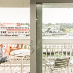 a woman relaxing on a balcony