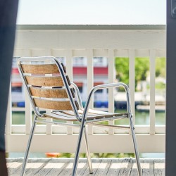 a close up of a chair on a porch