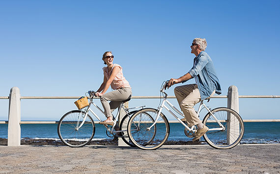 couple riding bikes along the weater