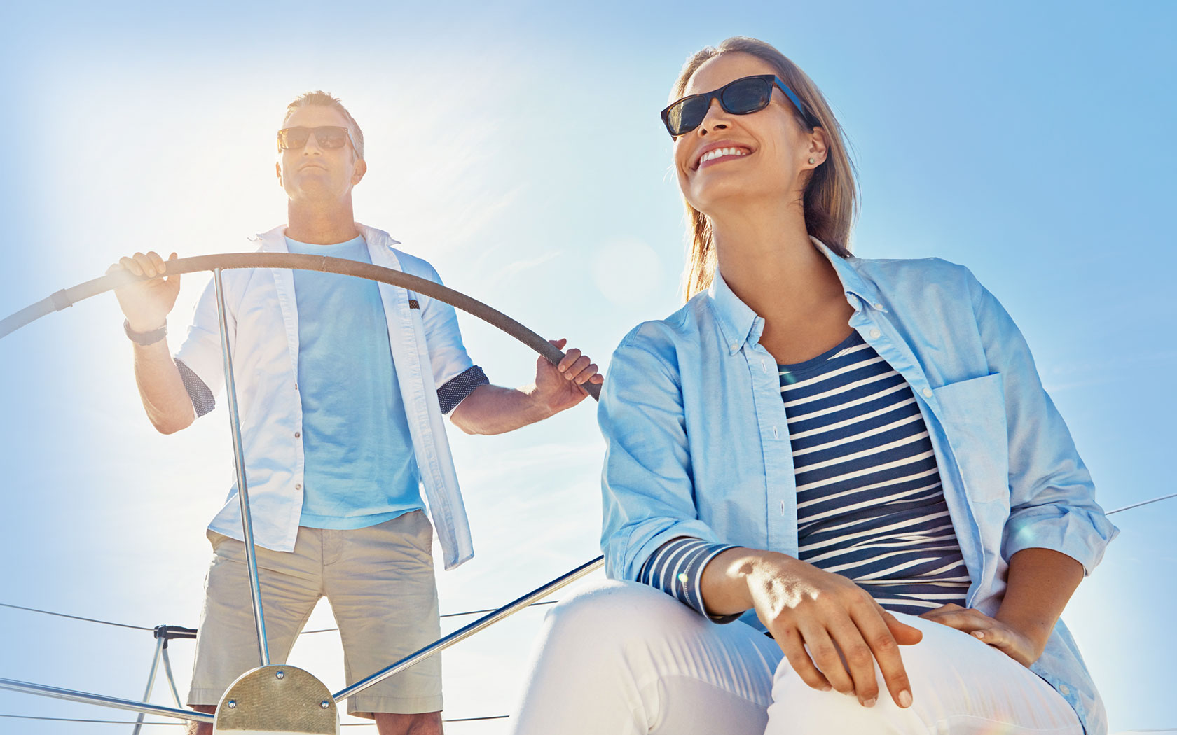 older couple navigating a boat