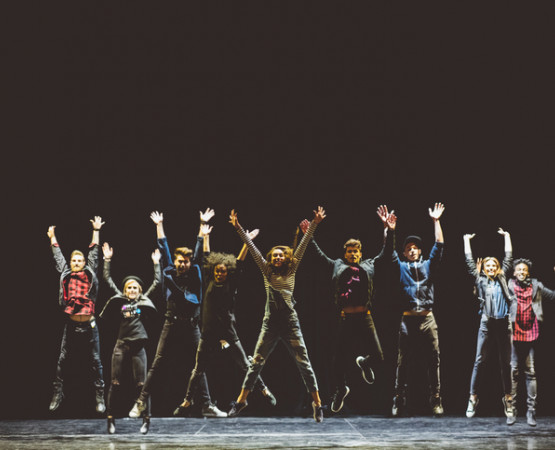 actors jumping on stage