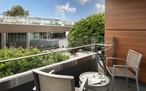 two chairs and table on balcony
