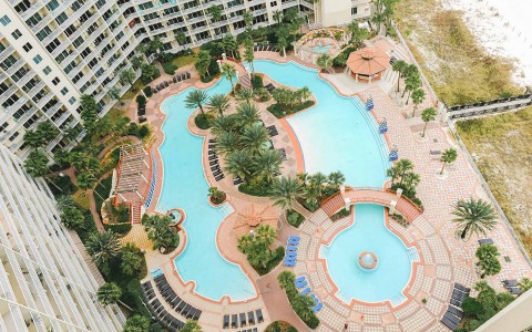 an aerial shot of the lazy river and pool