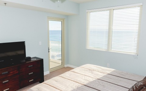 a bedroom with ocean views