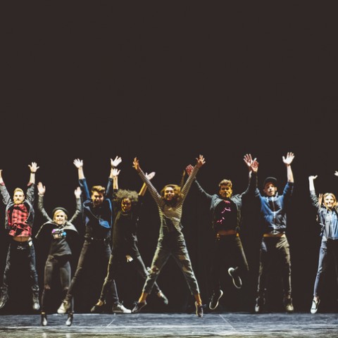 actors jumping on stage