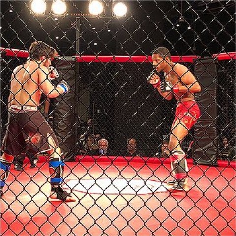 two people in a boxing ring boxing