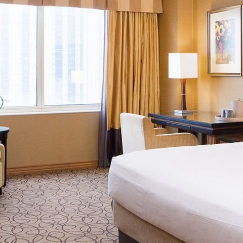 guest room with white bedding