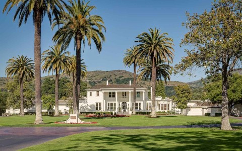 outdoor view of silverado in the sun with palm trees 