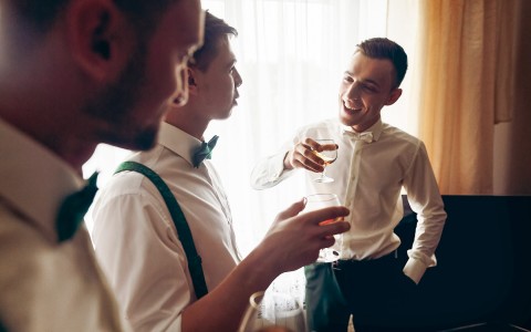 grooms men toasting to the groom 