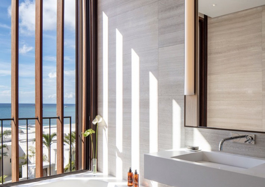 Interior view of the bathroom of the penthouse level king room at Silversands Grenada