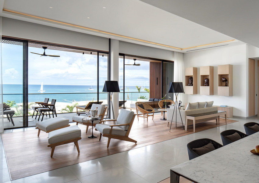 Interior view of the penthouse suite living room and dining room at Silversands Grenada with ocean view