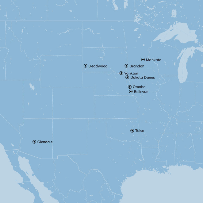 blue map of the united states with some cities pinned