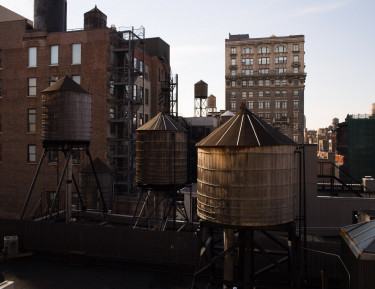 large elevated wooden bins on a rooftop in the city