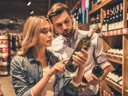 couple choosing a bottle of wine