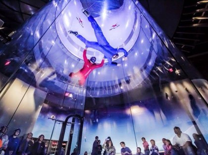 People indoor skydiving