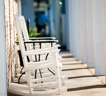 Porch with white rocking chairs
