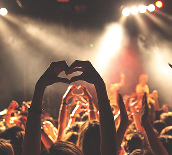 crowd watching a band perform on stage