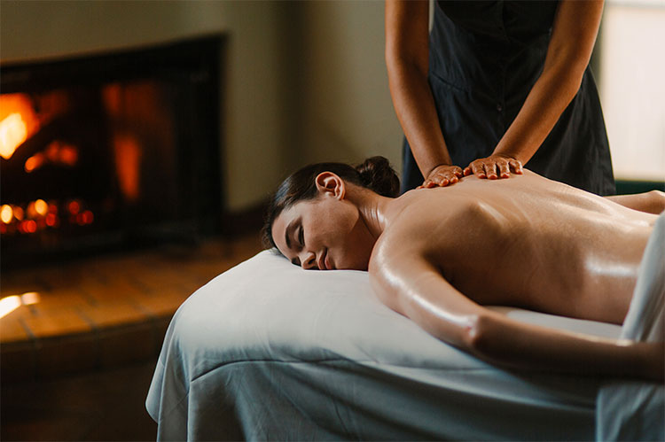 lady laying down having a back massage 