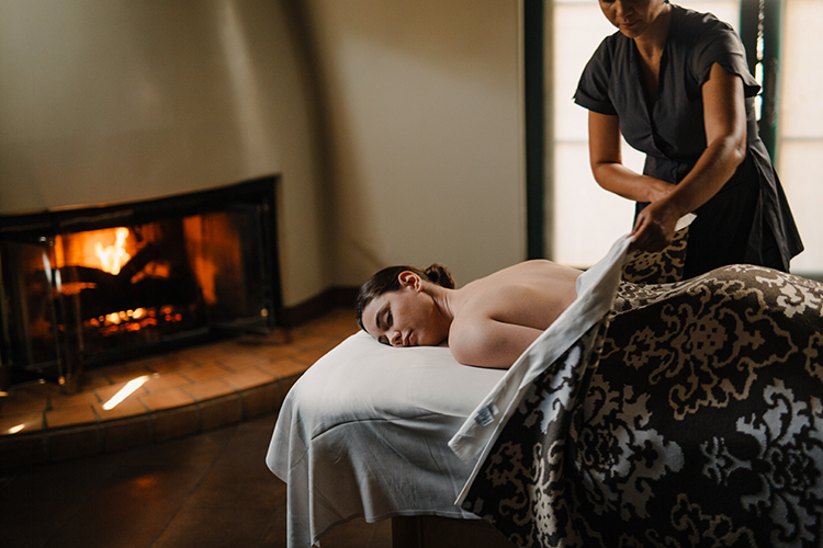 young lady laying down enjoying her time at the spa