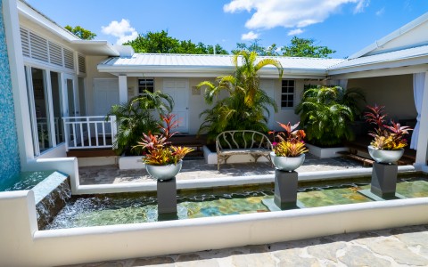 image of 2 exterior of 2 rooms at spice island beach resort