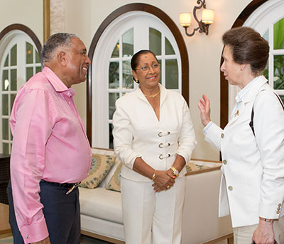 Sir Royston and Lady Hopkin greet Her Royal Highness, The Princess Royal, Princess Anne, upon her arrival at Spice Island Beach Resort