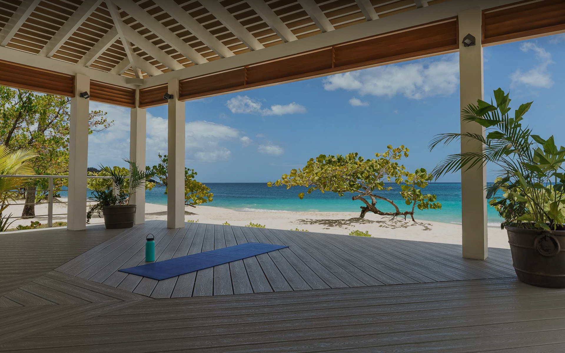 view of a yoga mat on a pavilion with the beach in the background