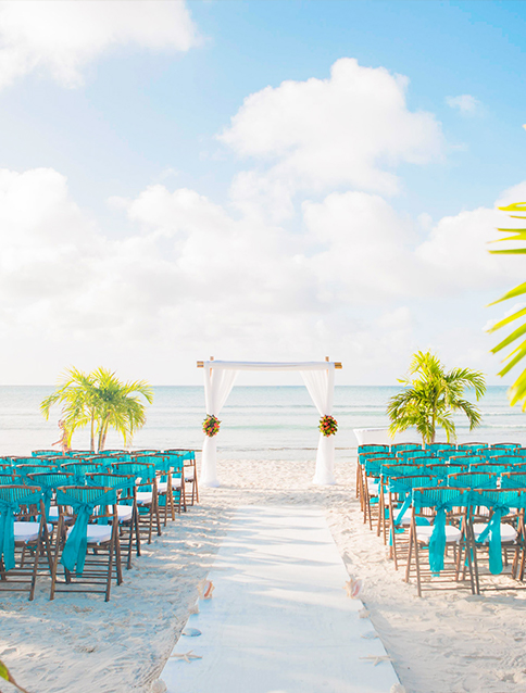 a wedding ceremony setup on the beach