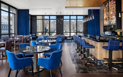 dining area with blue chairs as the main accent color