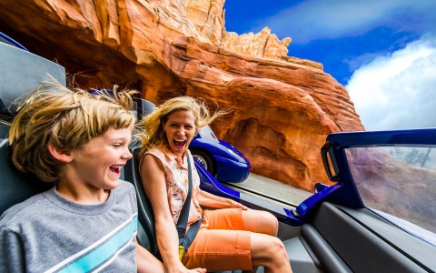 mom and son on ride laughing 