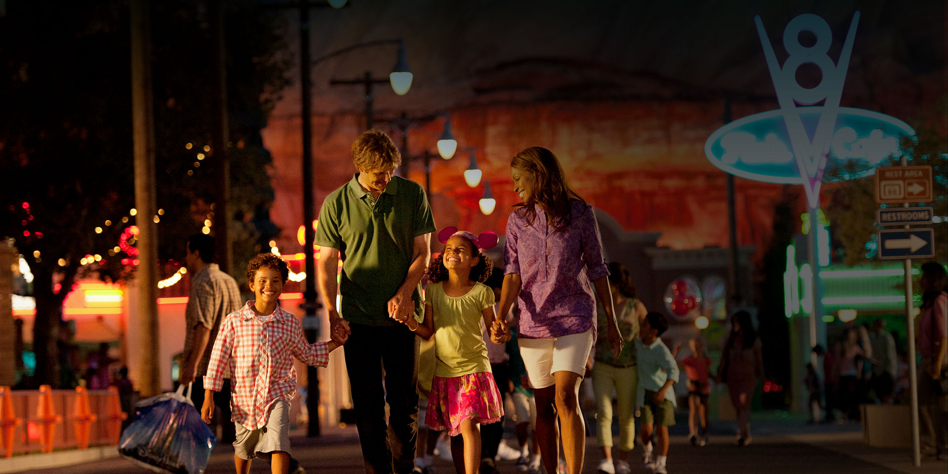family walking on the street at night