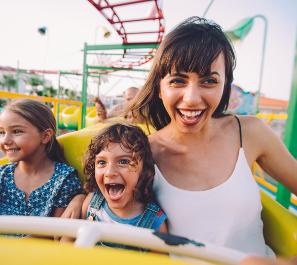 mom and daughters on a roller coaster